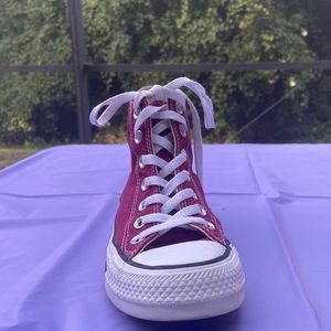 Burgundy High Top Chuck Taylor Converse.